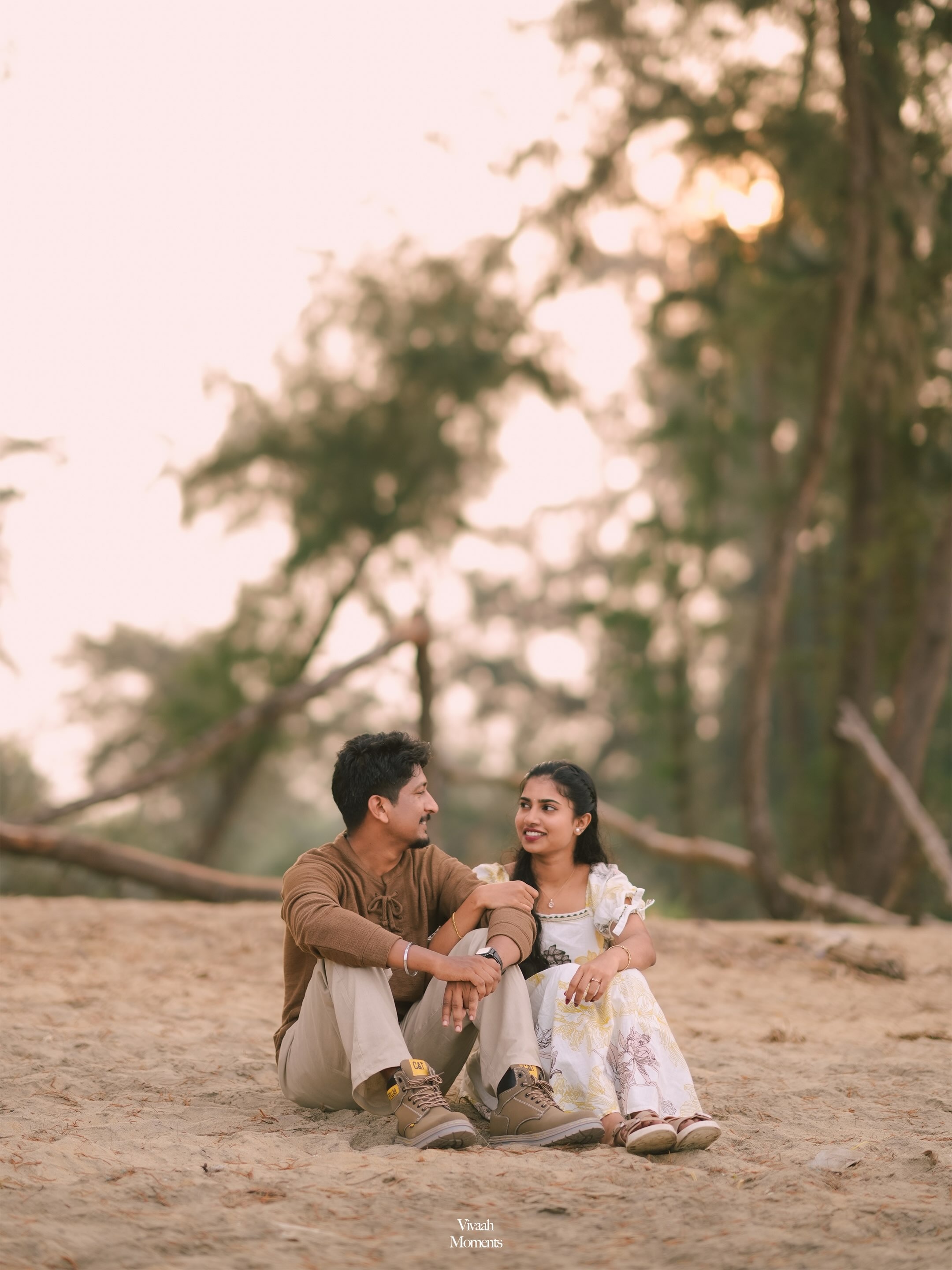 A couple sitting together in a softly lit outdoor setting